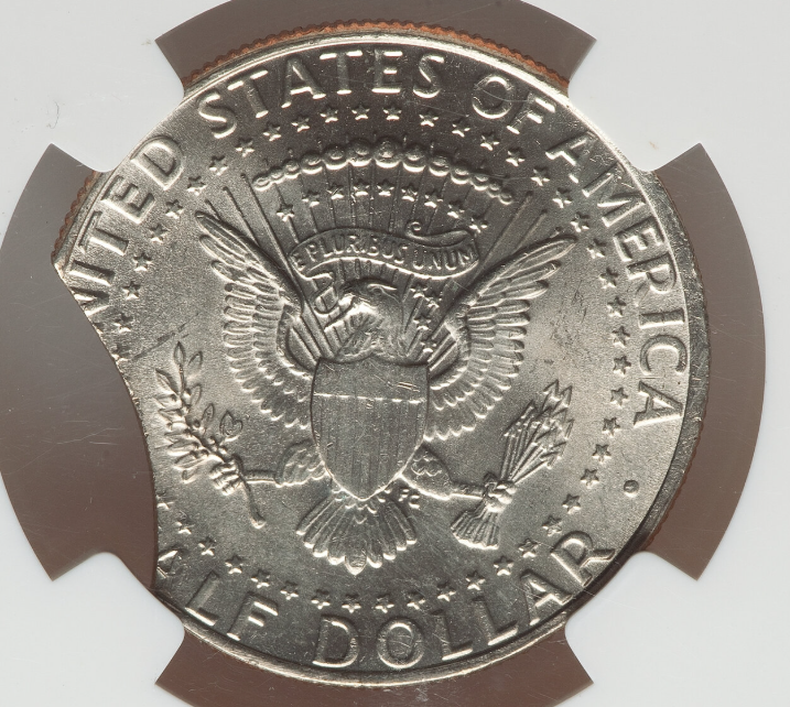 2014 Kennedy half dollar clipped planchet error with crescent-shaped missing rim section and Blakesley Effect