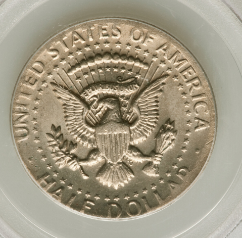 2014 Kennedy half dollar wrong planchet error showing size mismatch between half dollar design and smaller denomination planchet